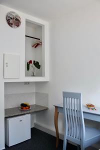 Kuchyň nebo kuchyňský kout v ubytování Motel Home Berlin