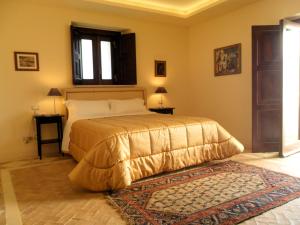 Posteľ alebo postele v izbe v ubytovaní Palazzo Viceconte