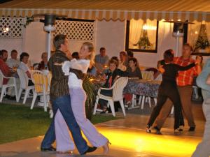 a group of people dancing on a dance floor at Hotel Hagerhof in Thiersee
