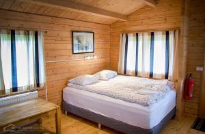 Säng eller sängar i ett rum på Hunkubakkar Guesthouse