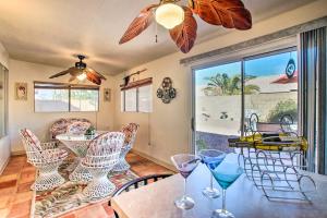 a dining room with a table with wine glasses on it at Pet-Friendly Central Phoenix Home with Large Patio! in Phoenix