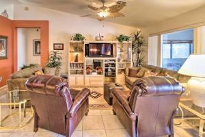 a living room with two couches and a tv at Pet-Friendly Central Phoenix Home with Large Patio! in Phoenix