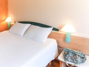 Postel nebo postele na pokoji v ubytování Ibis Murcia