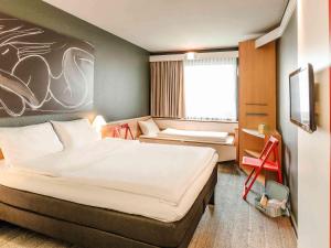 Posteľ alebo postele v izbe v ubytovaní ibis Wien City + 37 fotografií