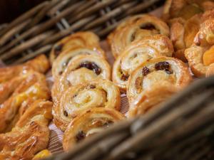 a bunch of pastries sitting in a basket at ibis Aberdeen Centre – Quayside in Aberdeen