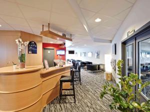 Ein Sitzbereich in der Unterkunft ibis Brussels Waterloo