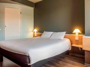 Postel nebo postele na pokoji v ubytování Ibis Salamanca