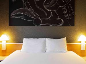 Postel nebo postele na pokoji v ubytování Ibis Salamanca