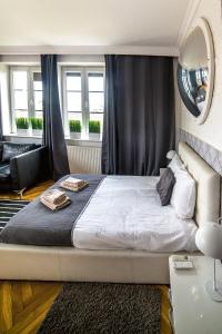 Posteľ alebo postele v izbe v ubytovaní Cracovia Apartments