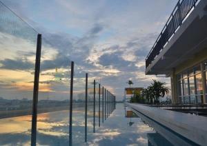 a building with a view of a body of water at EDU Hostel in Yogyakarta