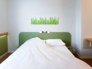 Posteľ alebo postele v izbe v ubytovaní Ibis budget Wien Messe