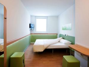 Posteľ alebo postele v izbe v ubytovaní Ibis budget Wien Messe