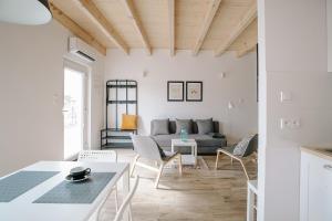 a living room with a couch and a table at Domki Kalinowa14 Kopalino in Kopalino
