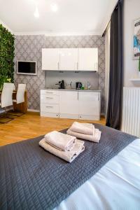 Posteľ alebo postele v izbe v ubytovaní Cracovia Apartments