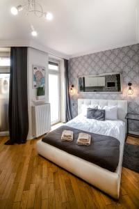 Posteľ alebo postele v izbe v ubytovaní Cracovia Apartments