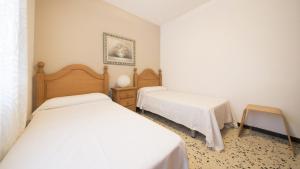 A bed or beds in a room at R28 APARTAMENTO MONTSERRAT 11-3