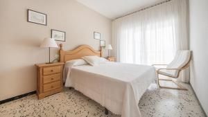 A bed or beds in a room at R28 APARTAMENTO MONTSERRAT 11-3