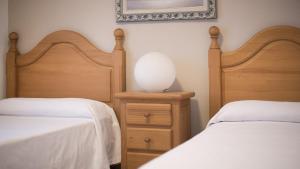 A bed or beds in a room at R28 APARTAMENTO MONTSERRAT 11-3