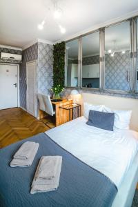Posteľ alebo postele v izbe v ubytovaní Cracovia Apartments
