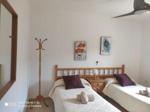 Кровать или кровати в номере MAR I MONTANYA Formentera 2