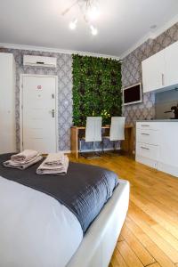 Posteľ alebo postele v izbe v ubytovaní Cracovia Apartments