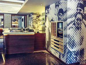 a bathroom with a counter and a sink in it at Mercure Jakarta Sabang in Jakarta