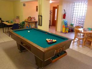 a living room with a pool table in the middle at Cozy Cottage in Baugnez Malmedy with Sauna in Malmedy