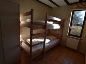 Postel nebo postele na pokoji v ubytování Stylish Holiday Home in Xhoffraix with Terrace