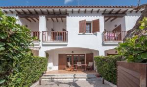 an external view of a house with a patio at Casa adosada 50m de la playa Calafell . WIFI gratis in Calafell