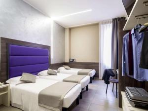 Postel nebo postele na pokoji v ubytování Ibis Styles Milano Centro