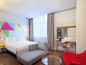 Voodi või voodid majutusasutuse Ibis Styles Jakarta Sunter toas