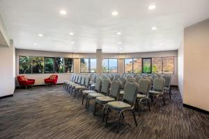 a conference room with chairs and windows at La Quinta by Wyndham Pomona in Pomona +37 photos