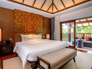 Postel nebo postele na pokoji v ubytování Pullman Luang Prabang