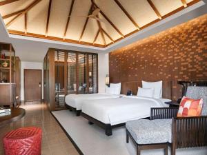 Postel nebo postele na pokoji v ubytování Pullman Luang Prabang