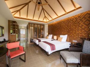Postel nebo postele na pokoji v ubytování Pullman Luang Prabang