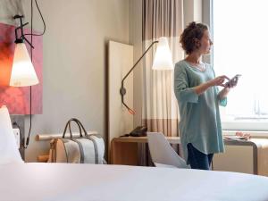Postel nebo postele na pokoji v ubytování ibis Wien Hauptbahnhof