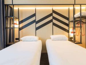 Ліжко або ліжка в номері ibis Styles Geneve Palexpo Aeroport