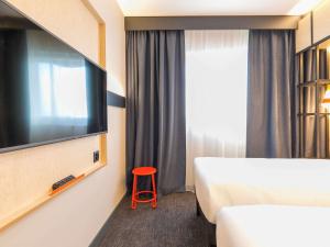 Ліжко або ліжка в номері ibis Styles Geneve Palexpo Aeroport