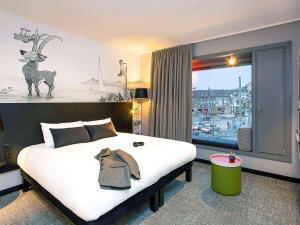 Postel nebo postele na pokoji v ubytování ibis Styles Genève Carouge + 37 fotografií