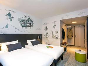 Postel nebo postele na pokoji v ubytování ibis Styles Genève Carouge