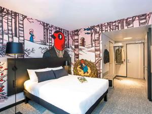 Postel nebo postele na pokoji v ubytování ibis Styles Genève Carouge