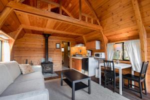 a living room and kitchen in a log cabin at Backeddy Resort and Marina in Egmont
