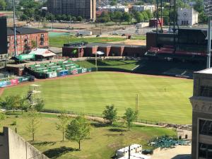 an empty baseball field in a city with a ballpark at Hotel Indigo - Memphis Downtown, an IHG Hotel in Memphis