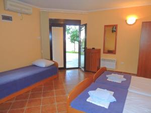 Postel nebo postele na pokoji v ubytování Villa Budvanka Guesthouse
