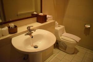 a bathroom with a sink and a toilet at Sala Prabang Hotel in Luang Prabang