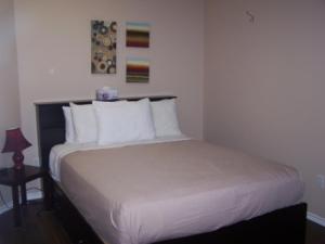 
A bed or beds in a room at Ocean Sands Resort Inc.
