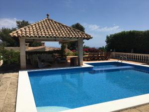 a swimming pool with a gazebo in a yard at Villa Santa Lavinia in Palma de Mallorca