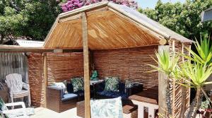 a gazebo with a couch in it at Inn-Style in Cape Town
