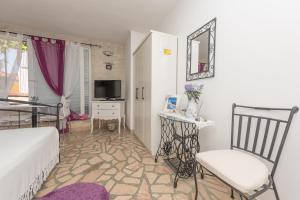 Posteľ alebo postele v izbe v ubytovaní Apartmani Antunović Podgora