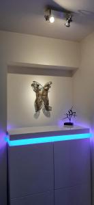 a room with a butterfly sculpture on the wall at Cannes Riviera in Cannes